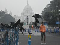 A person walks on the street on a smoggy morning due to air pollution in Kolkata, India, on November 24, 2024. (