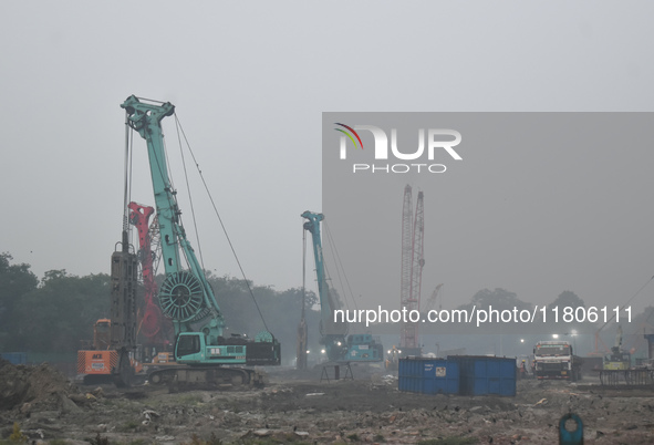 People work on a metro construction site on a smoggy morning due to air pollution in Kolkata, India, on November 24, 2024. 