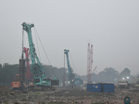 People work on a metro construction site on a smoggy morning due to air pollution in Kolkata, India, on November 24, 2024. (