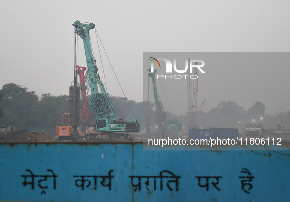 People work on a metro construction site on a smoggy morning due to air pollution in Kolkata, India, on November 24, 2024. 