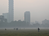 People play inside the ground on a smoggy morning due to air pollution in Kolkata, India, on November 24, 2024. (