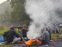 People burn fires, causing smoke on a smoggy morning in Kolkata, India, on November 24, 2024. (