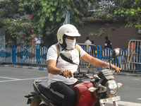 A person rides a bike on a smoggy morning due to air pollution in Kolkata, India, on November 24, 2024. (