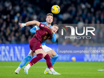 Artem Dovbyk of AS Roma and Amir Rrahmani of SSC Napoli compete for the ball during the serie Serie A Enilive match between SSC Napoli and A...