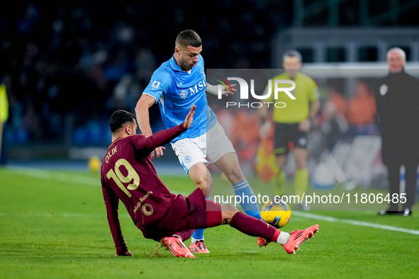 Zeki Celik of AS Roma and Alessandro Buongiorno of SSC Napoli compete for the ball during the serie Serie A Enilive match between SSC Napoli...