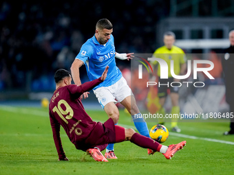 Zeki Celik of AS Roma and Alessandro Buongiorno of SSC Napoli compete for the ball during the serie Serie A Enilive match between SSC Napoli...