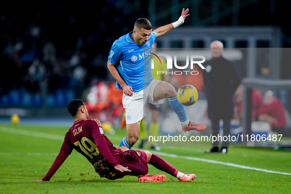 Zeki Celik of AS Roma and Alessandro Buongiorno of SSC Napoli compete for the ball during the serie Serie A Enilive match between SSC Napoli...