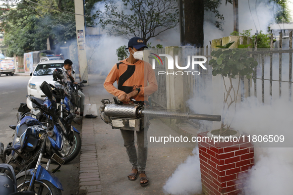 A man sprays insecticide to kill mosquitoes in Dhaka, Bangladesh, on November 24, 2024. At least eleven dengue patients die in the last 24 h...