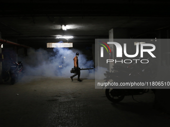 A man sprays insecticide to kill mosquitoes in Dhaka, Bangladesh, on November 24, 2024. At least eleven dengue patients die in the last 24 h...