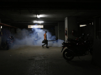 A man sprays insecticide to kill mosquitoes in Dhaka, Bangladesh, on November 24, 2024. At least eleven dengue patients die in the last 24 h...