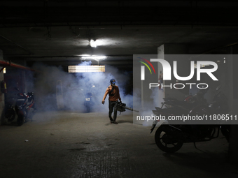 A man sprays insecticide to kill mosquitoes in Dhaka, Bangladesh, on November 24, 2024. At least eleven dengue patients die in the last 24 h...