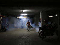 A man sprays insecticide to kill mosquitoes in Dhaka, Bangladesh, on November 24, 2024. At least eleven dengue patients die in the last 24 h...