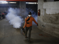 A man sprays insecticide to kill mosquitoes in Dhaka, Bangladesh, on November 24, 2024. At least eleven dengue patients die in the last 24 h...