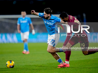 Khvicha Kvaratskhelia of SSC Napoli and Zeki Celik of AS Roma compete for the ball during the serie Serie A Enilive match between SSC Napoli...