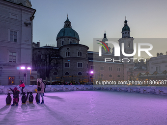 People enjoy the pre-Christmas atmosphere in the old town of Salzburg, Austria, on December 7, 2023. (