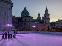 People enjoy the pre-Christmas atmosphere in the old town of Salzburg, Austria, on December 7, 2023. (