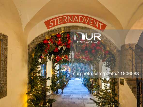 People enjoy the pre-Christmas atmosphere in the old town of Salzburg, Austria, on December 7, 2023. 