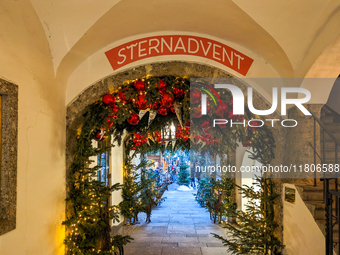 People enjoy the pre-Christmas atmosphere in the old town of Salzburg, Austria, on December 7, 2023. (