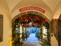 People enjoy the pre-Christmas atmosphere in the old town of Salzburg, Austria, on December 7, 2023. (