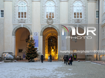 People enjoy the pre-Christmas atmosphere in the old town of Salzburg, Austria, on December 7, 2023. (