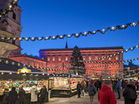 People enjoy the pre-Christmas atmosphere in the old town of Salzburg, Austria, on December 7, 2023. (