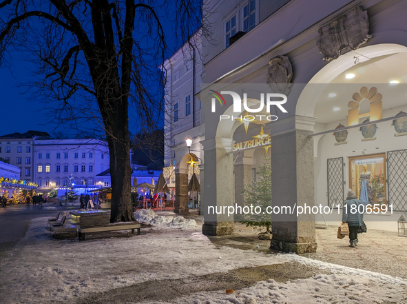 People enjoy the pre-Christmas atmosphere in the old town of Salzburg, Austria, on December 7, 2023. 