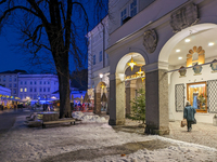 People enjoy the pre-Christmas atmosphere in the old town of Salzburg, Austria, on December 7, 2023. (