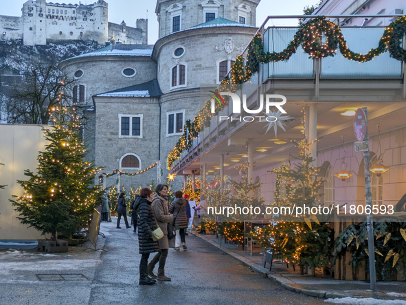 People enjoy the pre-Christmas atmosphere in the old town of Salzburg, Austria, on December 7, 2023. 