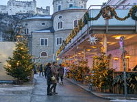 People enjoy the pre-Christmas atmosphere in the old town of Salzburg, Austria, on December 7, 2023. (