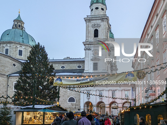 People enjoy the pre-Christmas atmosphere in the old town of Salzburg, Austria, on December 7, 2023. (