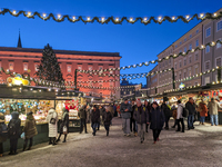 People enjoy the pre-Christmas atmosphere in the old town of Salzburg, Austria, on December 7, 2023. (