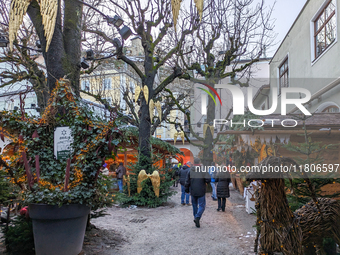 People enjoy the pre-Christmas atmosphere in the old town of Salzburg, Austria, on December 7, 2023. (