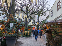 People enjoy the pre-Christmas atmosphere in the old town of Salzburg, Austria, on December 7, 2023. (