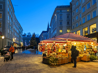 People enjoy the pre-Christmas atmosphere in the old town of Salzburg, Austria, on December 7, 2023. (