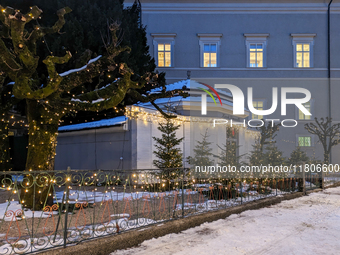 People enjoy the pre-Christmas atmosphere in the old town of Salzburg, Austria, on December 7, 2023. (