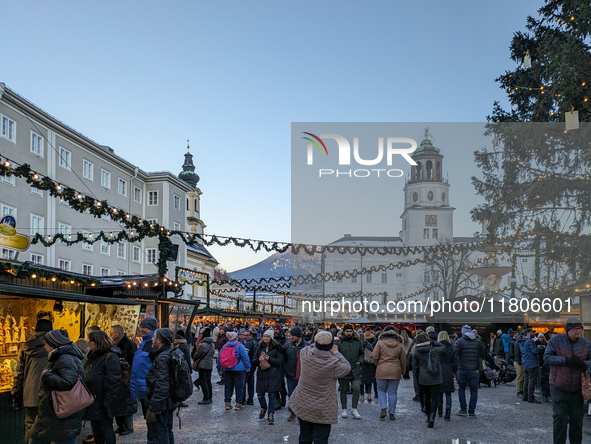 People enjoy the pre-Christmas atmosphere in the old town of Salzburg, Austria, on December 7, 2023. 