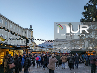 People enjoy the pre-Christmas atmosphere in the old town of Salzburg, Austria, on December 7, 2023. (