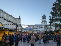 People enjoy the pre-Christmas atmosphere in the old town of Salzburg, Austria, on December 7, 2023. (