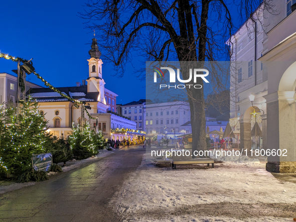 People enjoy the pre-Christmas atmosphere in the old town of Salzburg, Austria, on December 7, 2023. 