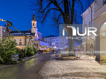 People enjoy the pre-Christmas atmosphere in the old town of Salzburg, Austria, on December 7, 2023. (