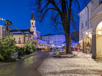 People enjoy the pre-Christmas atmosphere in the old town of Salzburg, Austria, on December 7, 2023. (