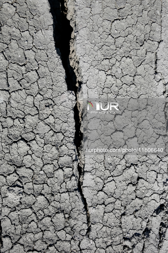 An austere, harsh landscape of dry mud left on mud volcano in Gobustan region near Baku, Azerbaijan on November 24, 2024. 