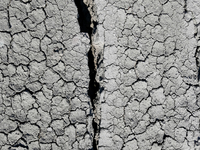 An austere, harsh landscape of dry mud left on mud volcano in Gobustan region near Baku, Azerbaijan on November 24, 2024. (