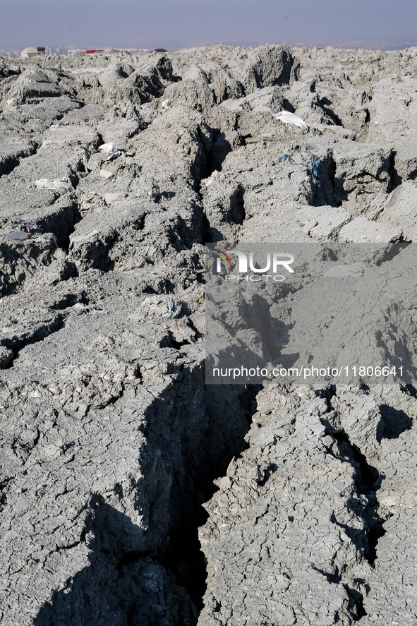 An austere, harsh landscape of dry mud left on mud volcano in Gobustan region near Baku, Azerbaijan on November 24, 2024. 