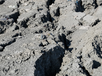 An austere, harsh landscape of dry mud left on mud volcano in Gobustan region near Baku, Azerbaijan on November 24, 2024. (