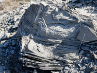 A piece of mud seen in an austere, harsh landscape of dry mud left on mud volcano in Gobustan region near Baku, Azerbaijan on November 24, 2...