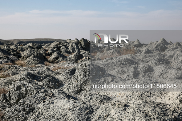 An austere, harsh landscape of dry mud left on mud volcano in Gobustan region near Baku, Azerbaijan on November 24, 2024. 