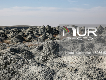 An austere, harsh landscape of dry mud left on mud volcano in Gobustan region near Baku, Azerbaijan on November 24, 2024. (