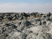 An austere, harsh landscape of dry mud left on mud volcano in Gobustan region near Baku, Azerbaijan on November 24, 2024. (