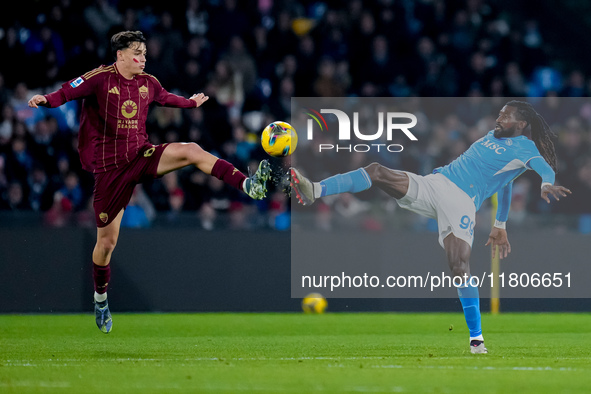 Niccolo' Pisilli of AS Roma and Andre-Frank Zambo Anguissa of SSC Napoli compete for the ball during the serie Serie A Enilive match between...